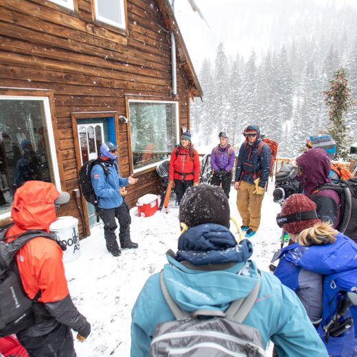 AIARE Avy 1 Hut Course participants congregating on the deck of a backcountry hut