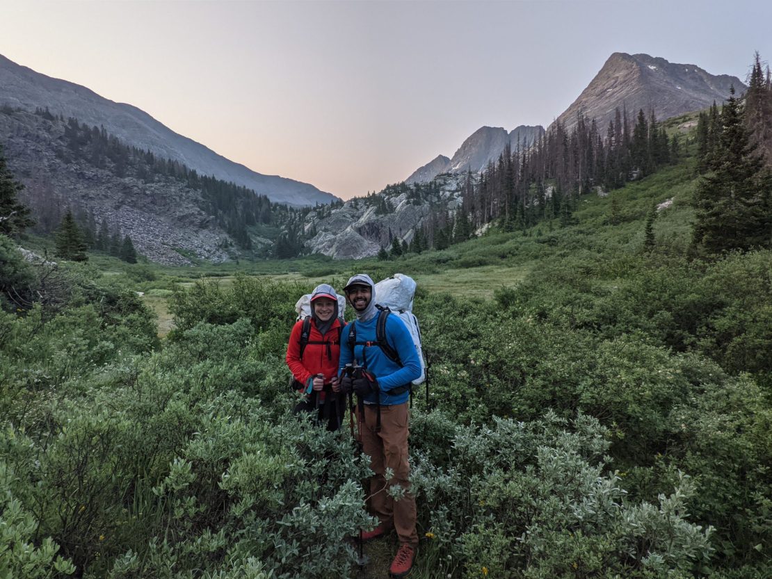 Two San Juan Expeditions clients posing in the Vestal Valley at dusk with Vestal Peak in the background