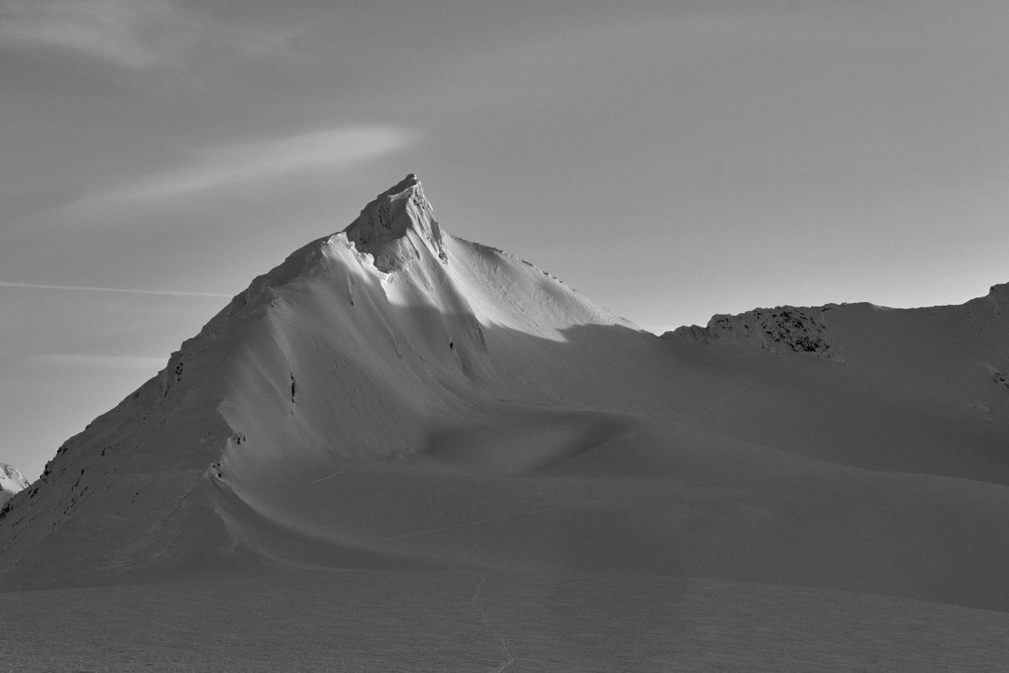 Snow covered spire in a black and white photo